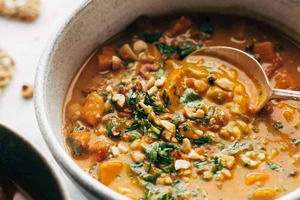 spicy peanut soup with sweet potato + kale