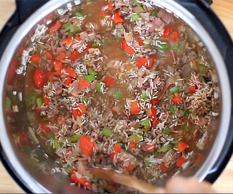 Add rice, spices and stock and stir