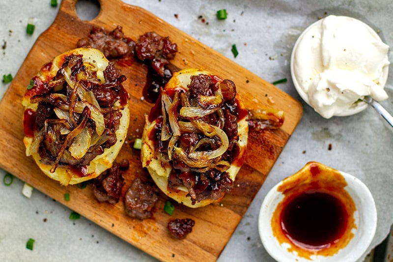 Stuffing baked potatoes with sausage and bbq sauce
