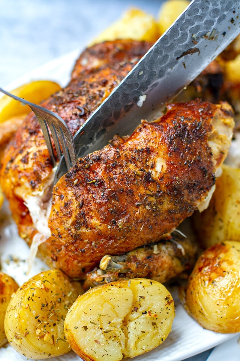 Instant Pot Whole Roast Chicken Carved On A Plate With Potatoes