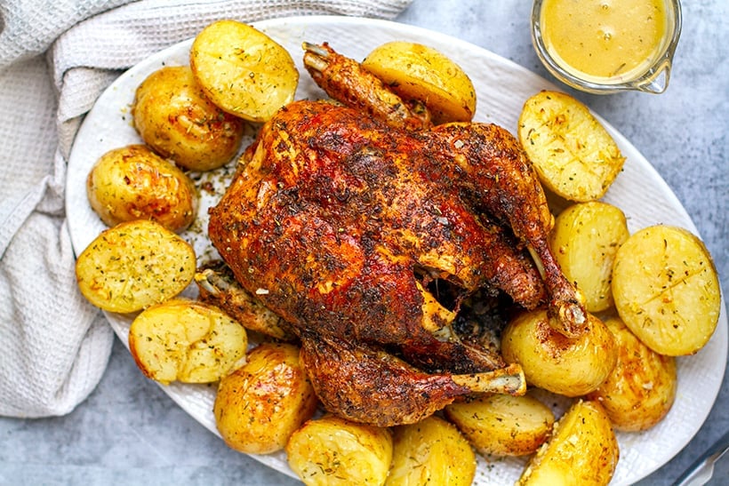 Whole roast chicken and potatoes