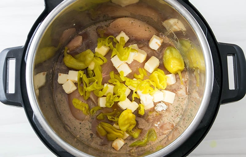 Step 3: add cubed butter and pepperoncini peppers.