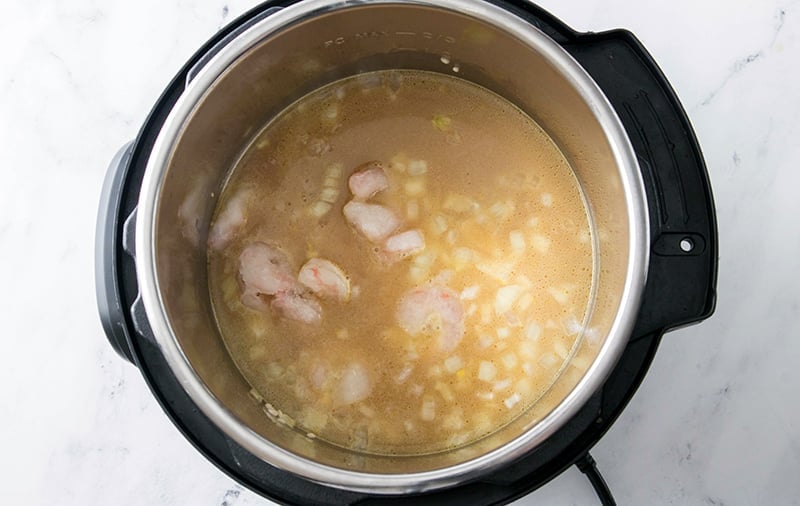Step 6 - add half of frozen shrimp to the pot