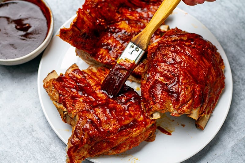 Brush the ribs with barbecue sauce