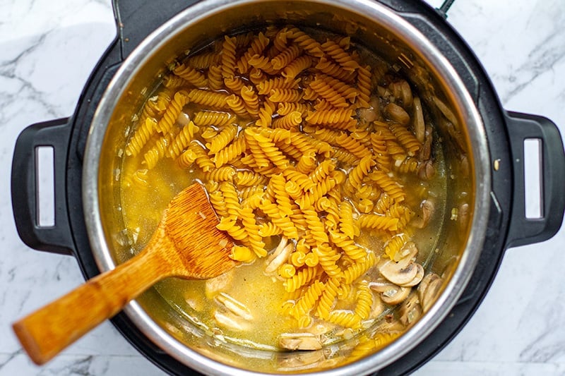 Add pasta and veggie stock