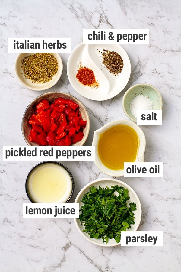 herbs, spices, pickled red peppers, olive oil, salt, lemon juice, parsley.