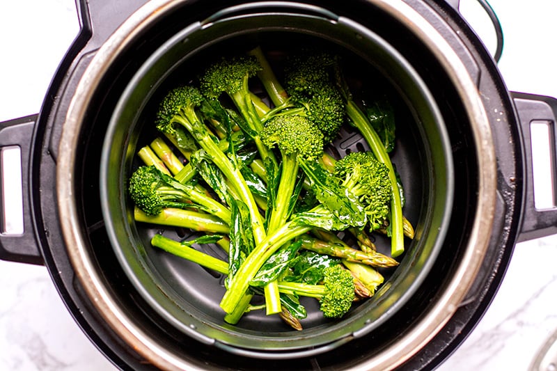 Broccoli and asparagus in the Instant Pot air fryer basket