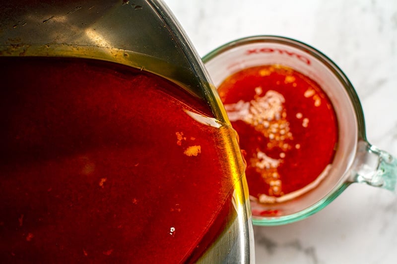 Pour our any leftover cooking broth into a jar