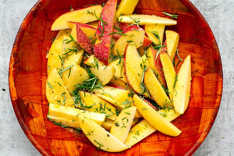 Toss potatoes with rosemary, oil and seasonings