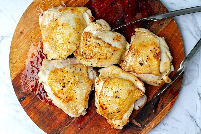 Remove cooked chicken to a board