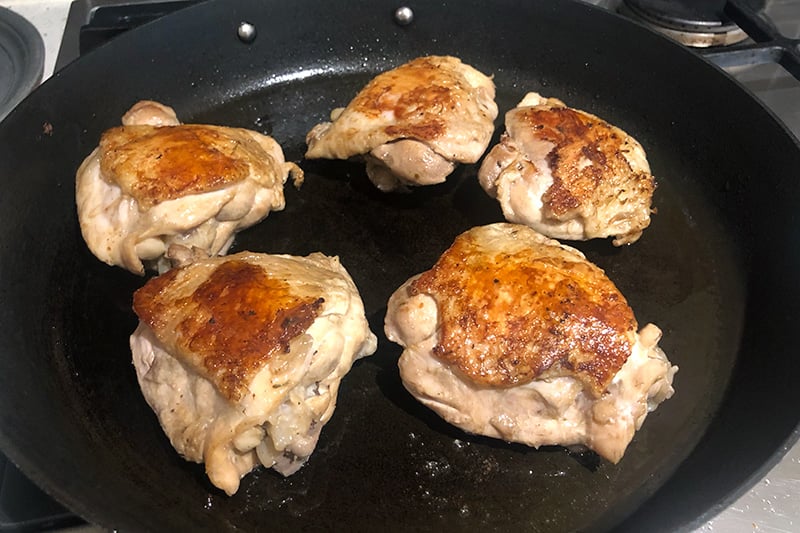 Pan frying the braised chicken pieces for extra crispiness