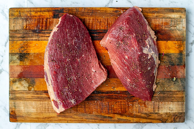 Cut the beef roast into chunks