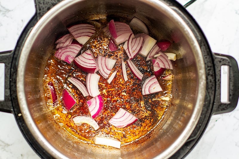 Sauteeing the onions in the pot for the gravy