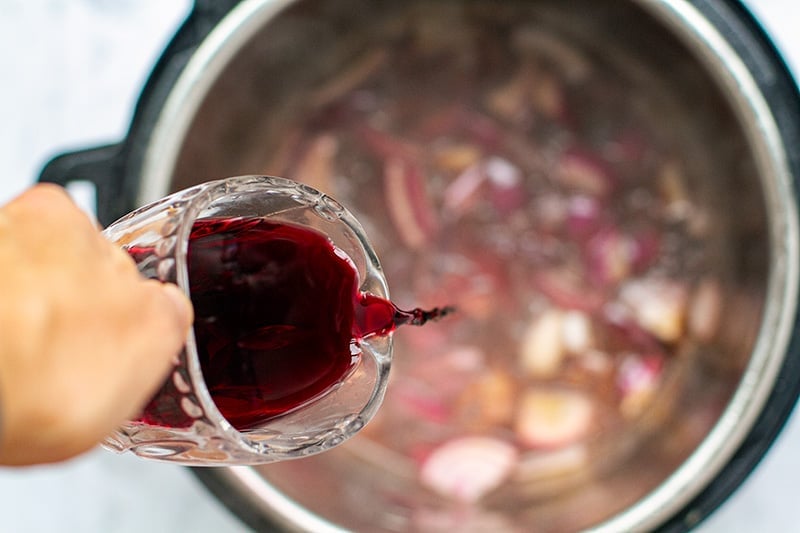 Deglaze the pot with red wine after cooking beef