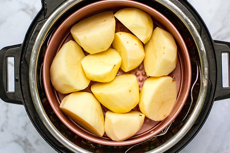 Potatoes in a cake pan in the Instant Pot