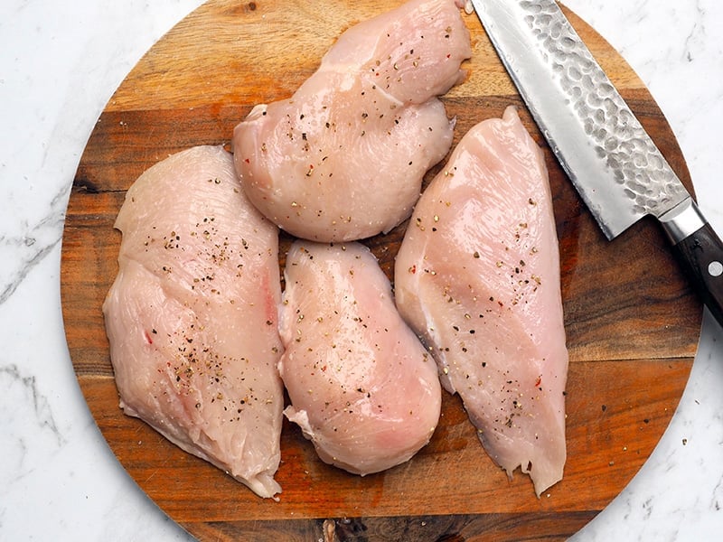 Setp 2 Season chicken breasts with salt and pepper