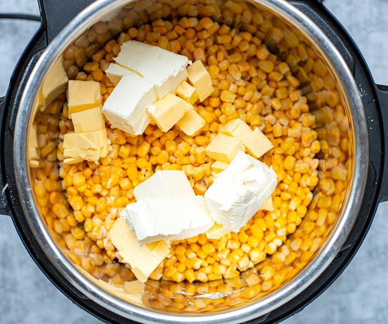 Add cream cheese and butter to the Instant Pot to make creamed corn