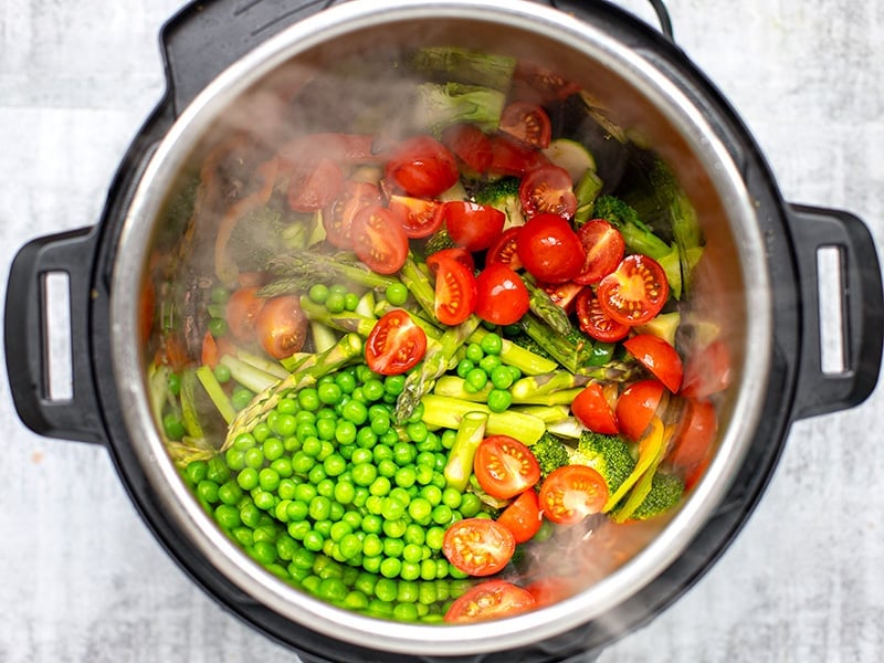 Add peas and cherry tomatoes