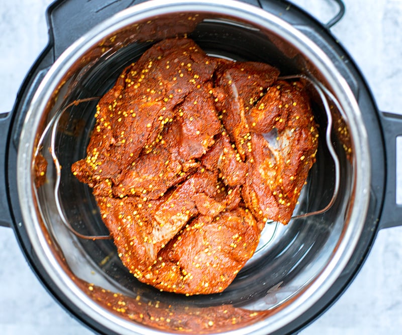 Marinated lamb on top of trivet in the Instant Pot