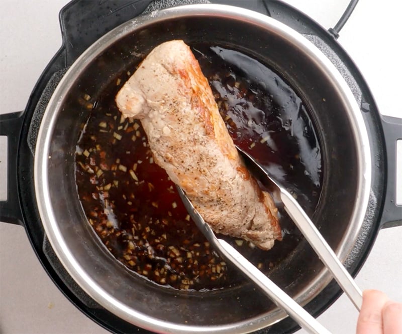 Remove cooked pork meat from the pot