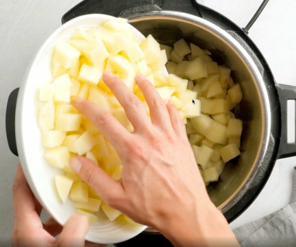 Add potatoes to leeks