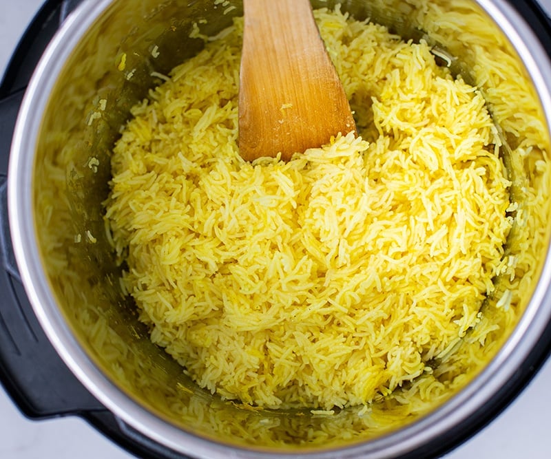Fluffing up yellow lemon rice