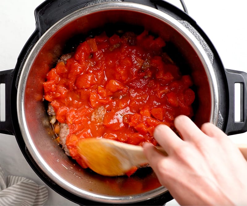 Spread tomatoes on top of the steaks