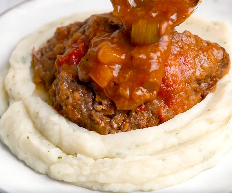 Serve the steaks over mashed potatoes with the sauce on top