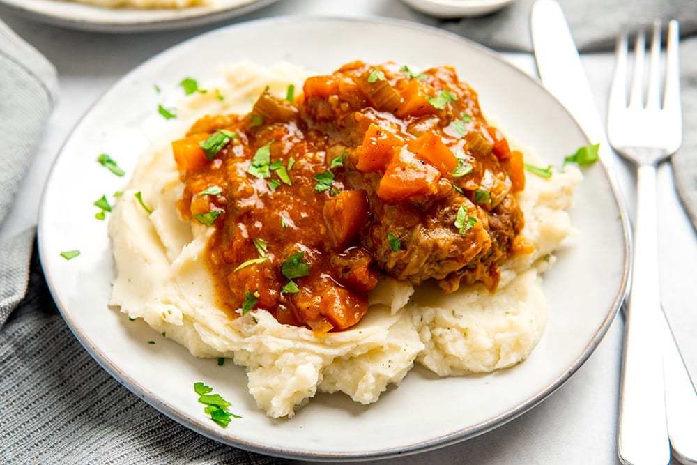 Instant Pot Swiss Steaks on mashed potatoes