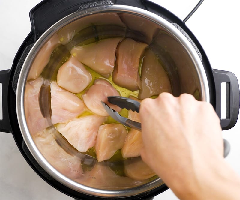 Add chicken and stock to Instant Pot