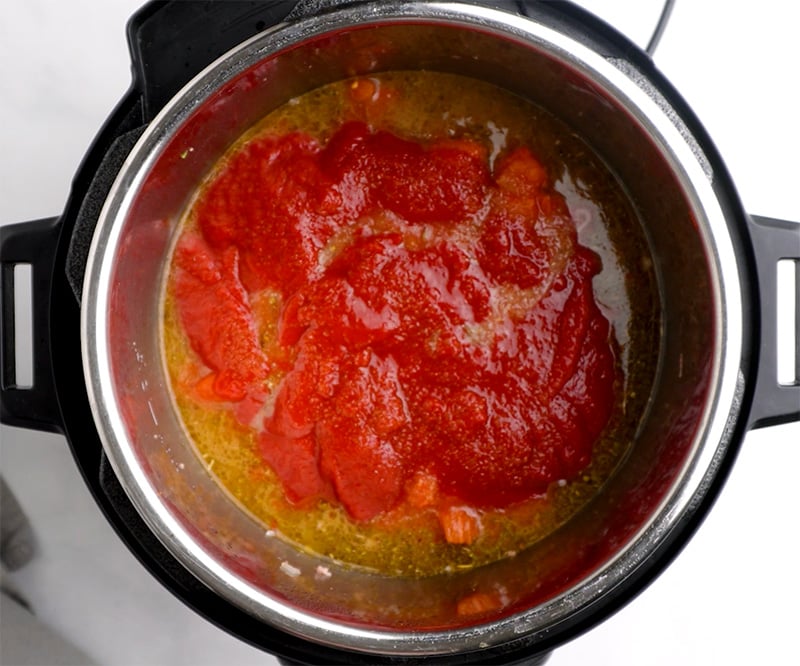 Spread tomato sauce on top of the soup