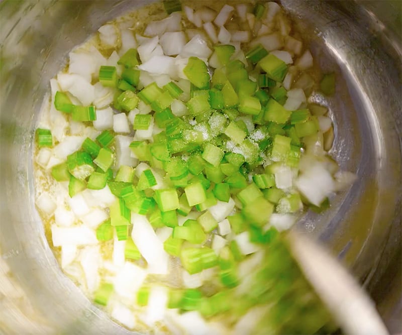 Turn the Saute on Normal mode. Melt the butter and add onions, celery and ½ teaspoon salt. 