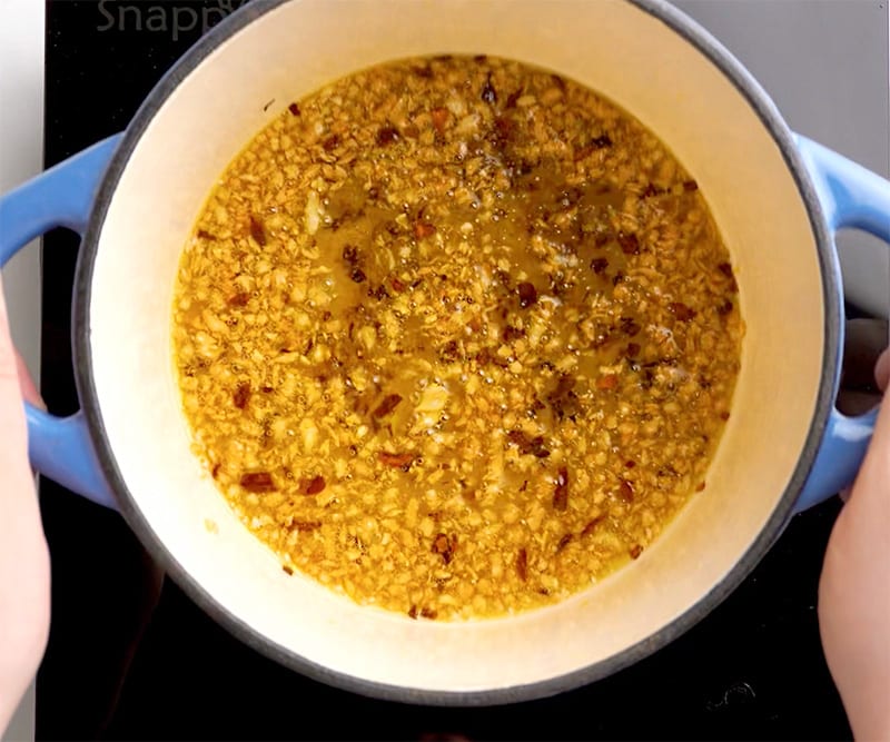 Chili garlic oil cooking in a pot