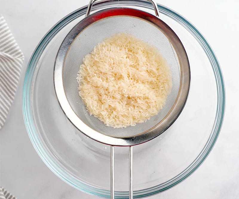 Rinse the rice under cold water.