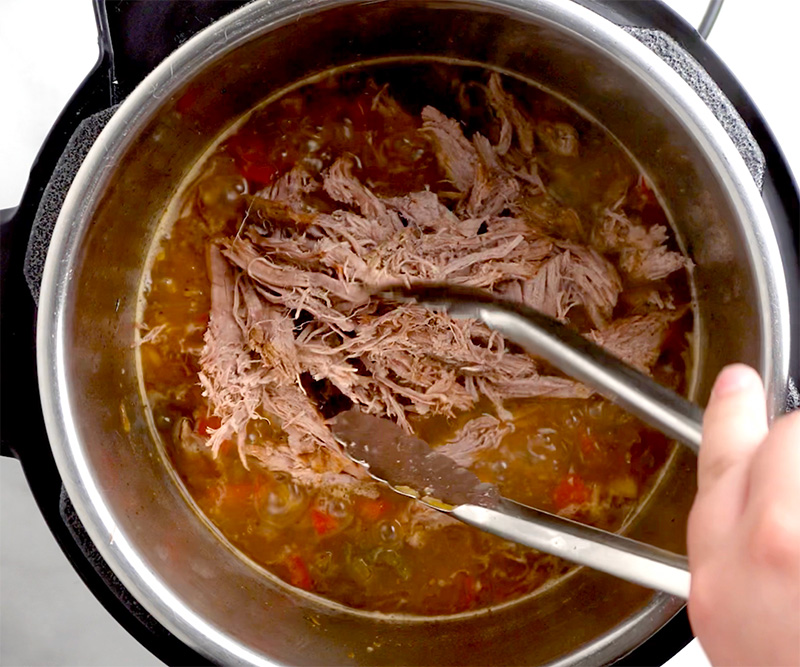 Return the sliced beef back to the sauce and stir through.
