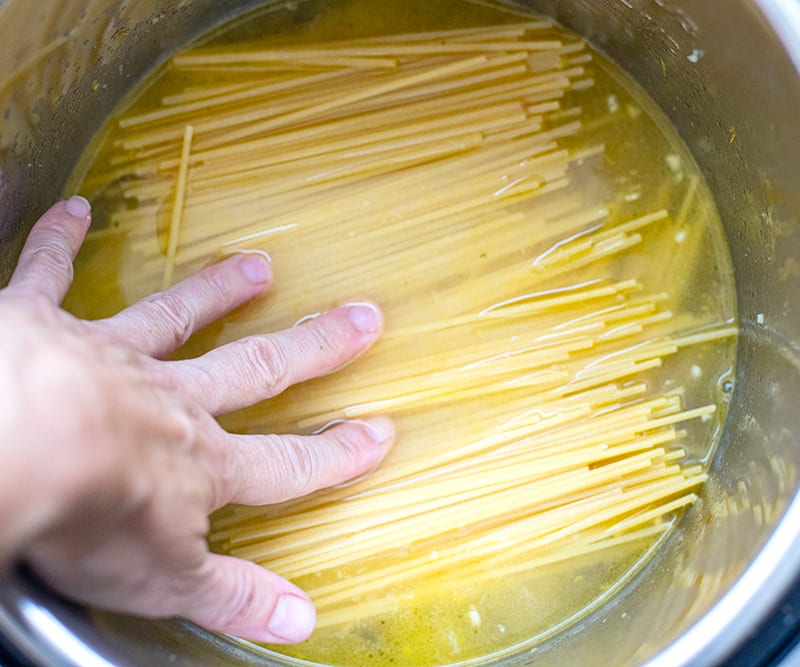 Gently immerse pasta in the stock for Spaghetti With Shrimp Scampi.