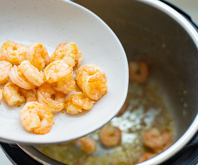 Remove the shrimp and set aside, but leave all those little brown bits of shrimp and garlic stuck to the bottom of the pot (known as a fond). For Spaghetti With Shrimp Scampi.