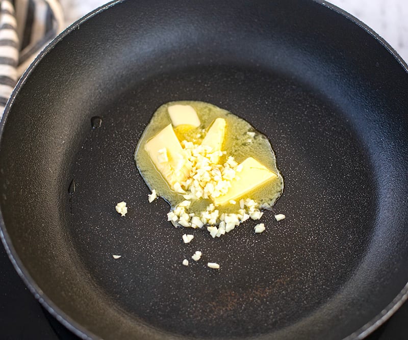 Heat up a small frying pan or a skillet over medium-high heat. You can also use it in the clean Instant Pot using the Saute setting. Add the butter and garlic and saute for a minute.