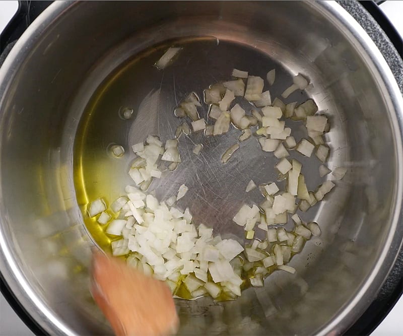 Add onions and olive oil to Instant Pot