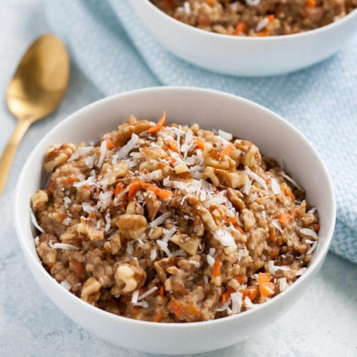 A warm and comforting Carrot Cake Oatmeal with grated carrots, cinnamon, and a hint of nutmeg, topped with nuts and a drizzle of maple syrup.








