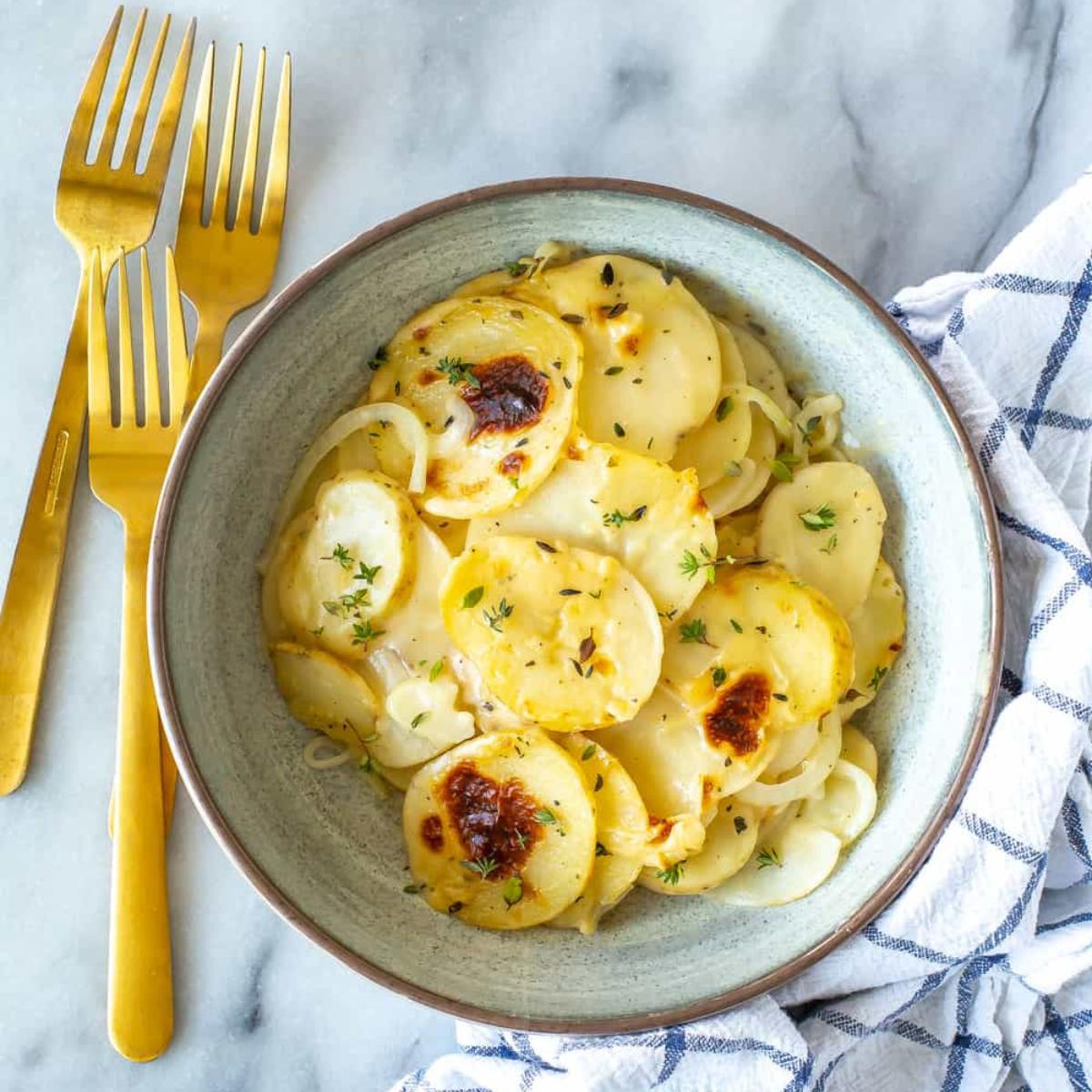 Rich and creamy Instant Pot Scalloped Potatoes, layered with tender slices of potato, cheese, and a creamy sauce.