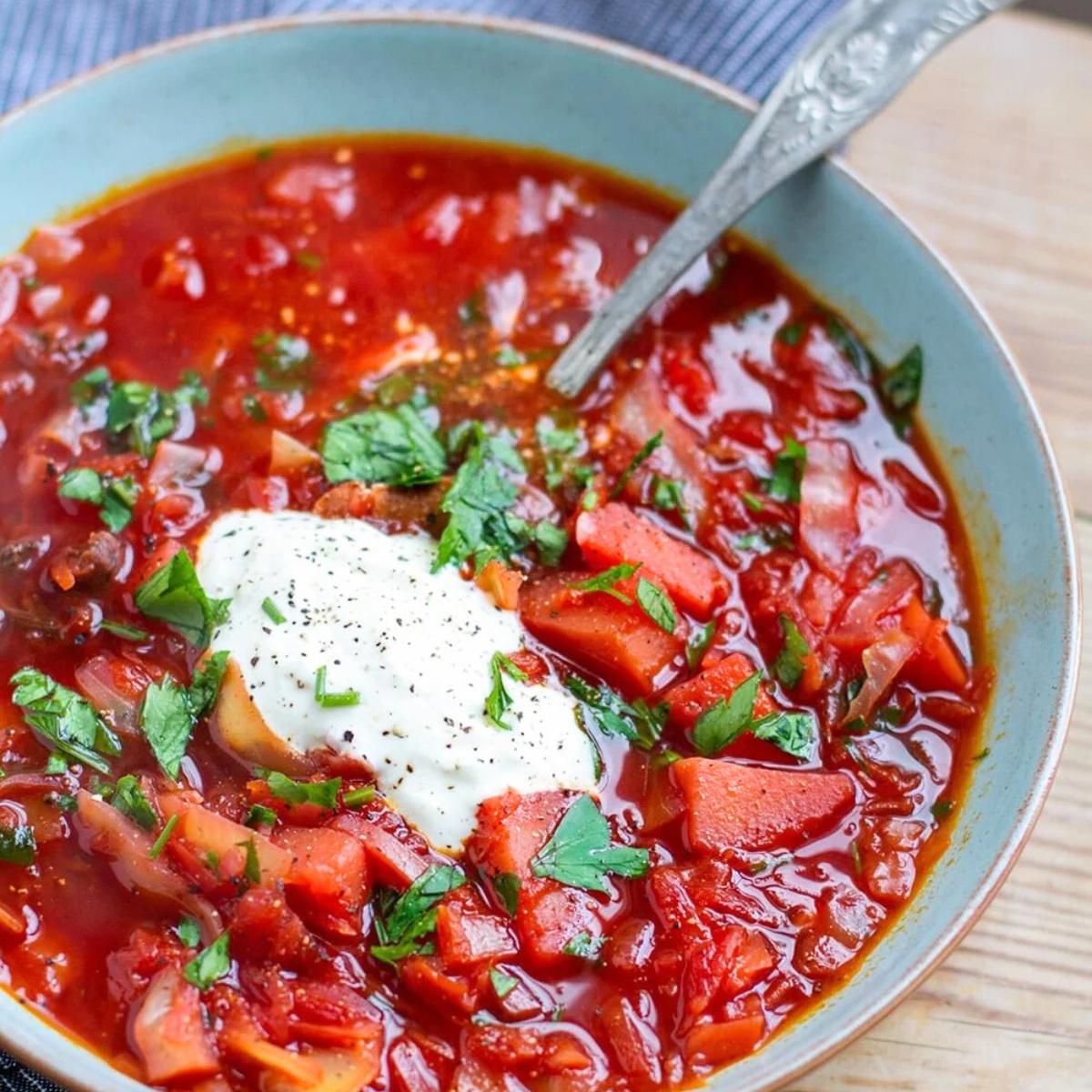 A vibrant and nutritious Healthy Borscht (Beet Soup) with earthy beets, cabbage, and vegetables, simmered in a rich broth and topped with fresh dill and a dollop of sour cream.







