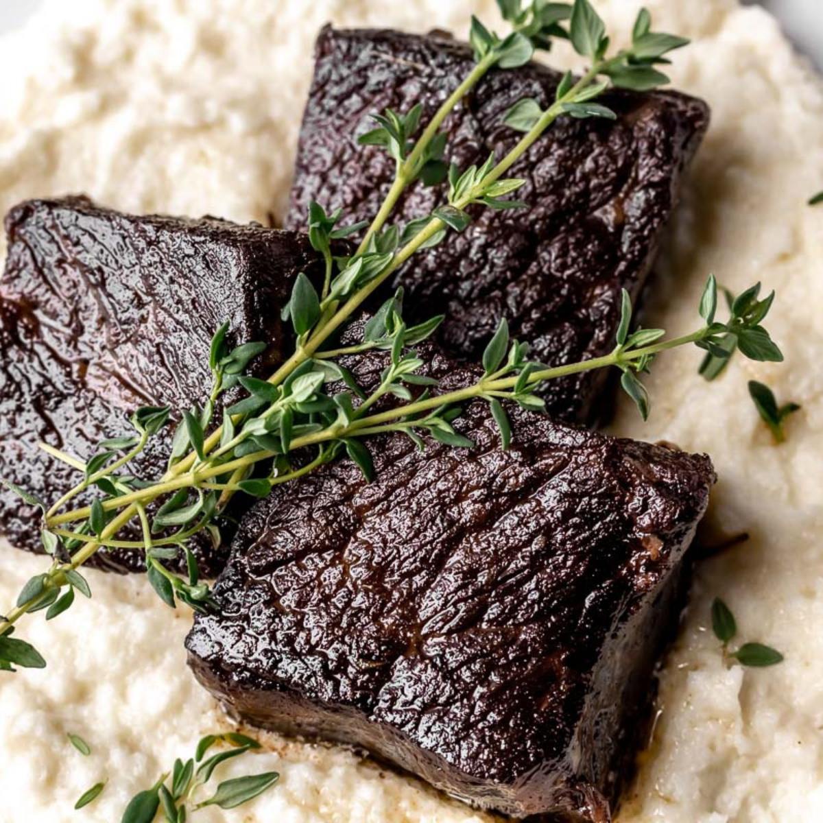 Tender Garlic Butter Instant Pot Short Ribs, cooked in a rich, savory garlic butter sauce.






