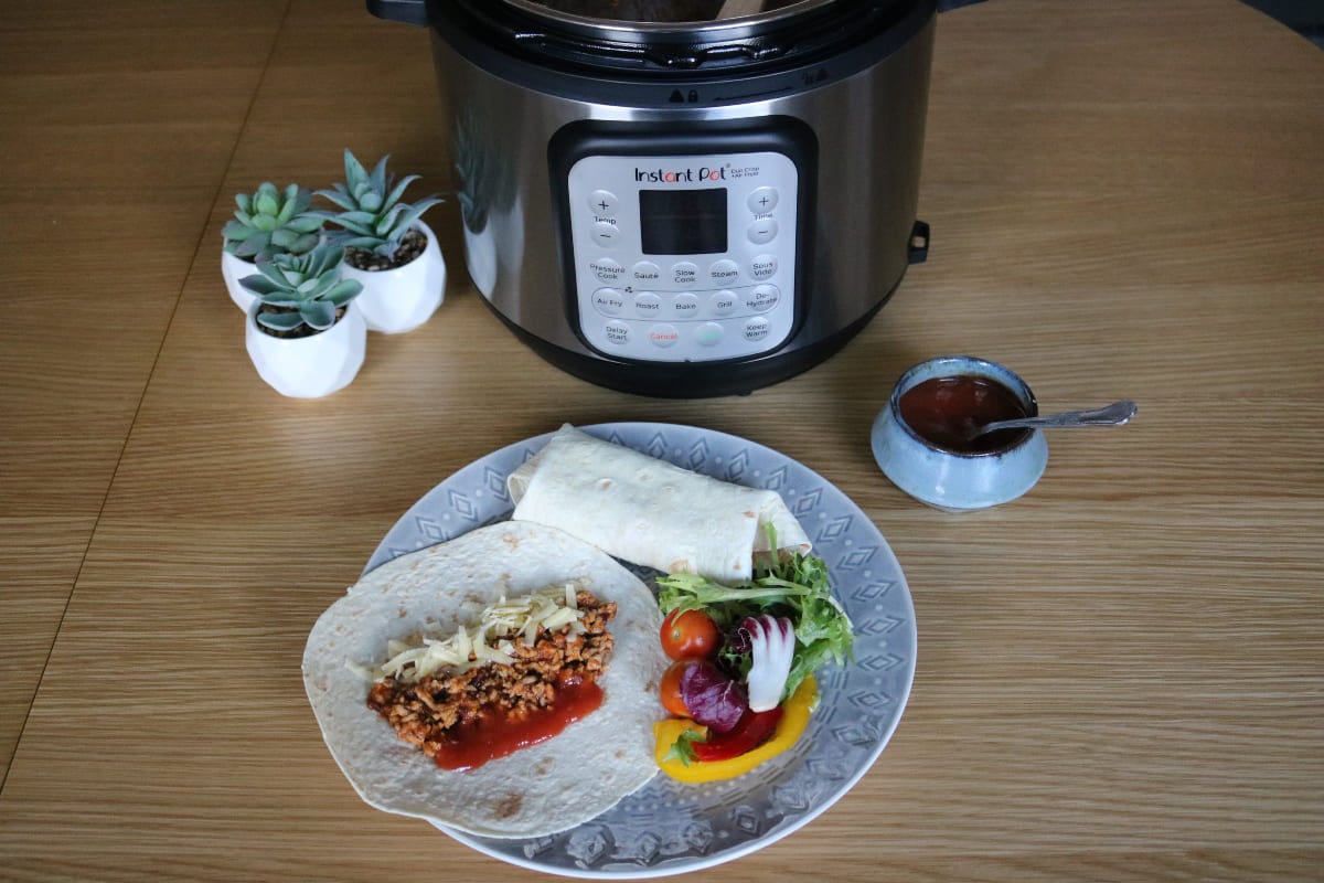 homemade burrito on plate and instant pot