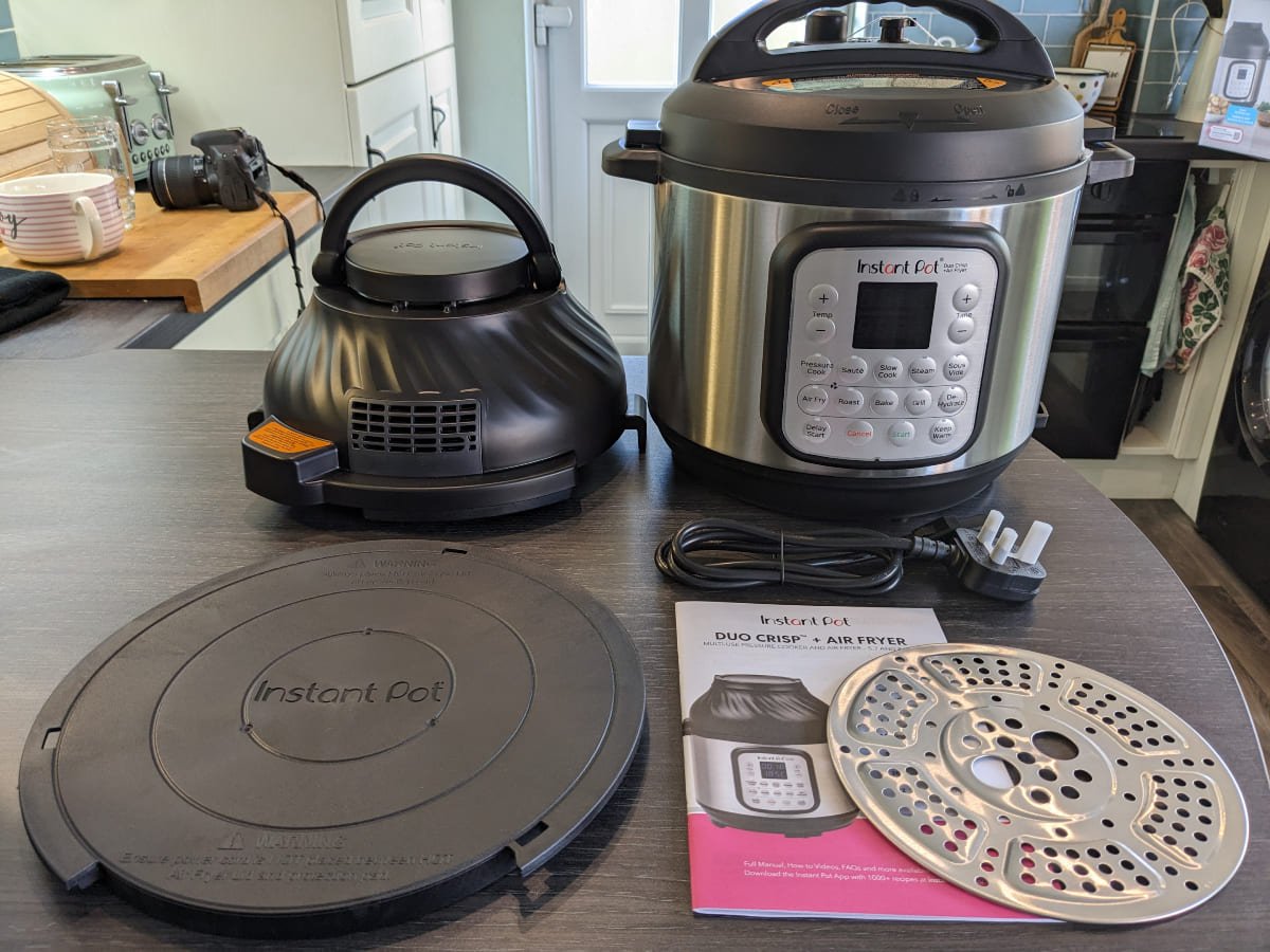 Instant Pot Duo Crisp Air inclusions laid out on kitchen counter