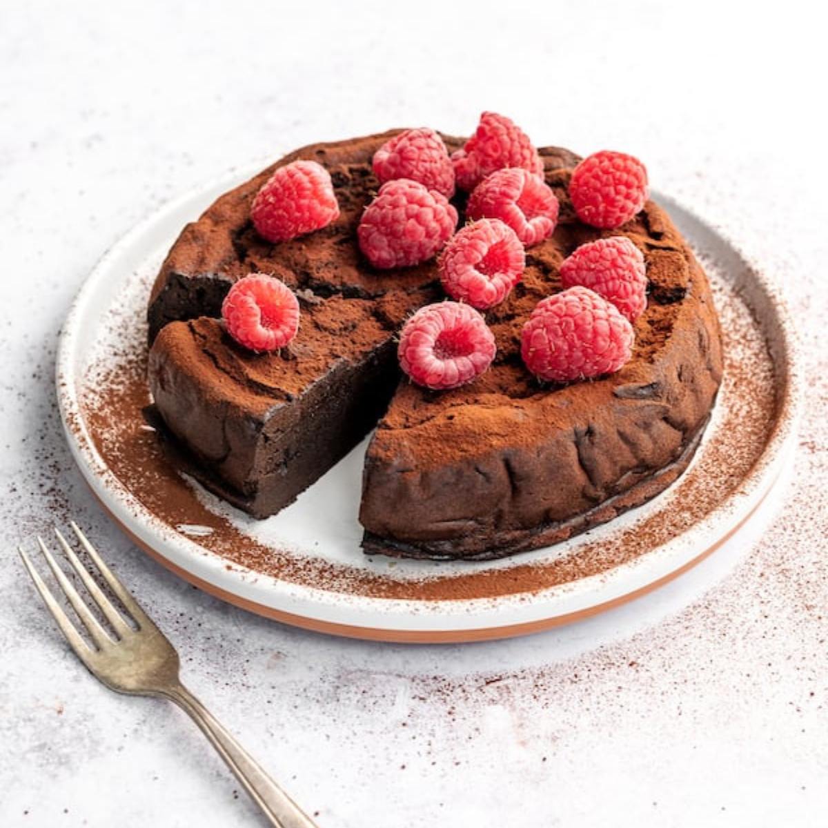 A rich and indulgent Keto Flourless Chocolate Cake made with dark chocolate, eggs, and almond flour, offering a moist, fudgy texture with low carbs.







