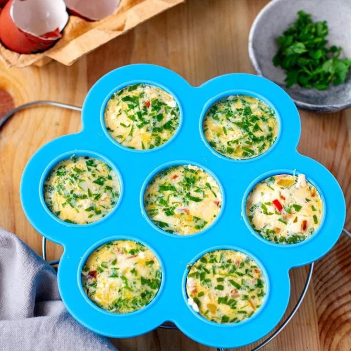 Fluffy Mediterranean Egg Bites with fresh herbs, crumbled feta, and a hint of garlic, perfect for a protein-packed breakfast or snack.







