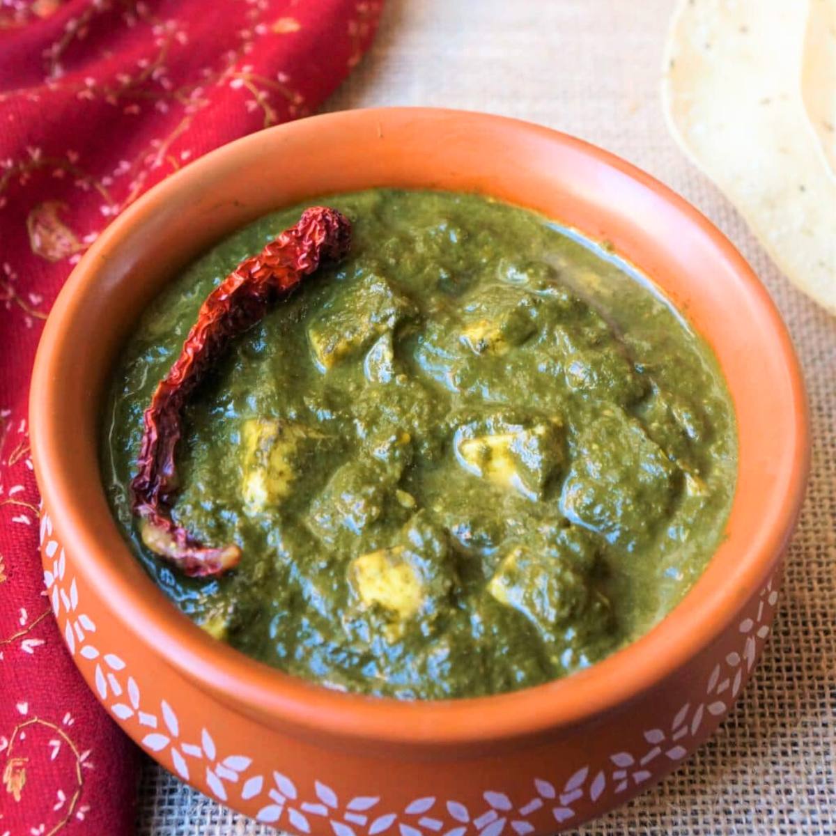 Delicious Palak Paneer, featuring soft paneer cubes cooked in a rich, spiced spinach gravy.





