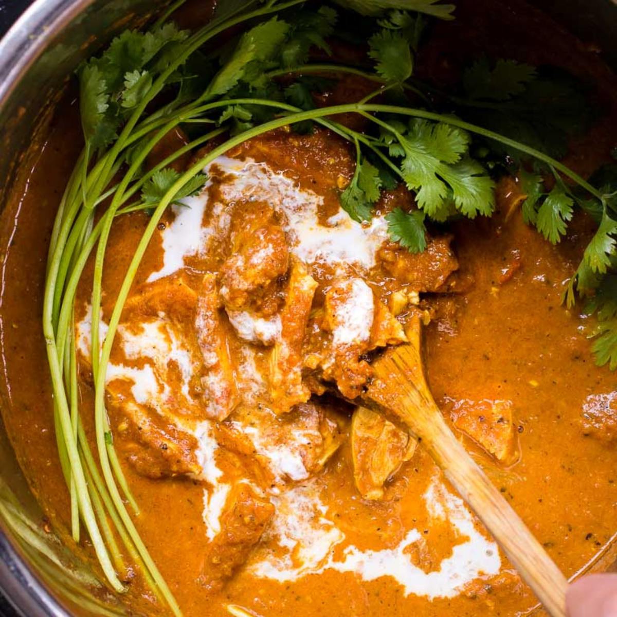 A creamy and flavorful Paleo Instant Pot Butter Chicken with tender chicken in a spiced tomato-coconut sauce.