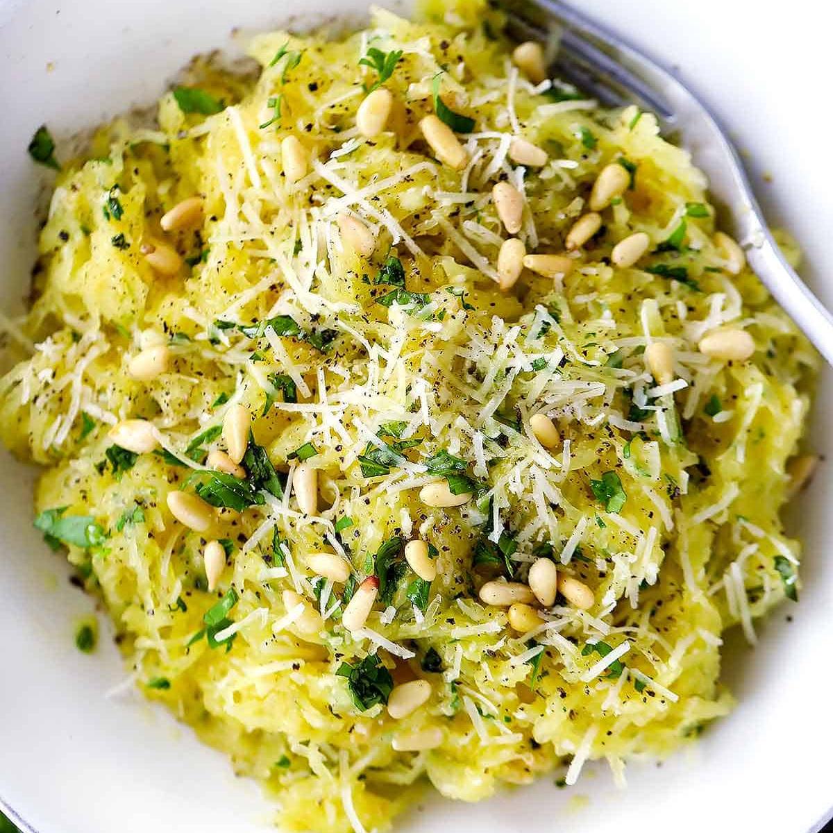 Roasted Spaghetti Squash with Garlic, perfectly cooked and tossed in olive oil, garlic, and herbs.